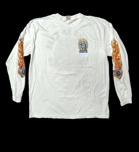 White long-sleeve shirt with flame designs on sleeves and a logo on chest against a black background